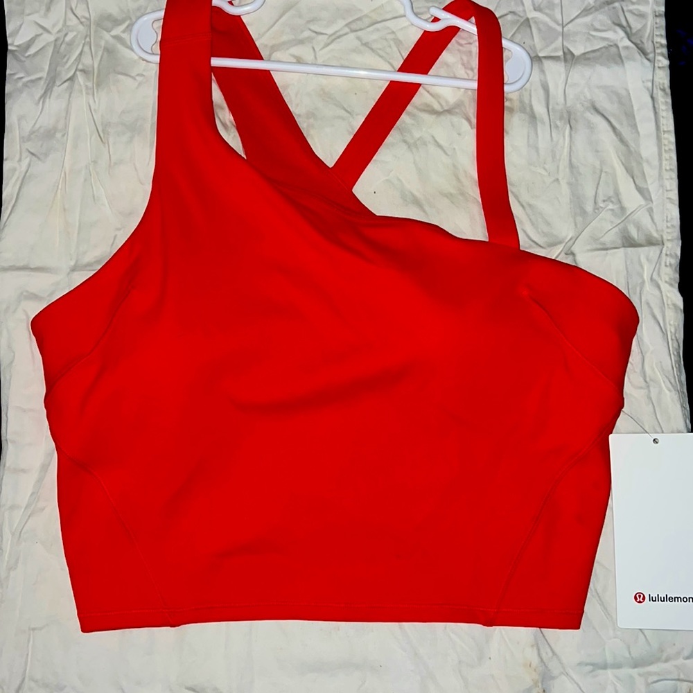 Brand new Lululemon. Cropped/Asymmetrical Tank. Different sizes available.